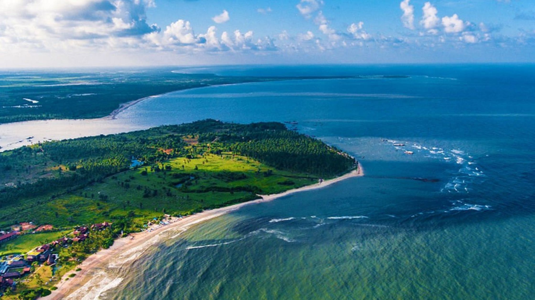 Scenic view of Pasikuda Beach with calm blue waters and soft sandy shore in Sri Lanka.
